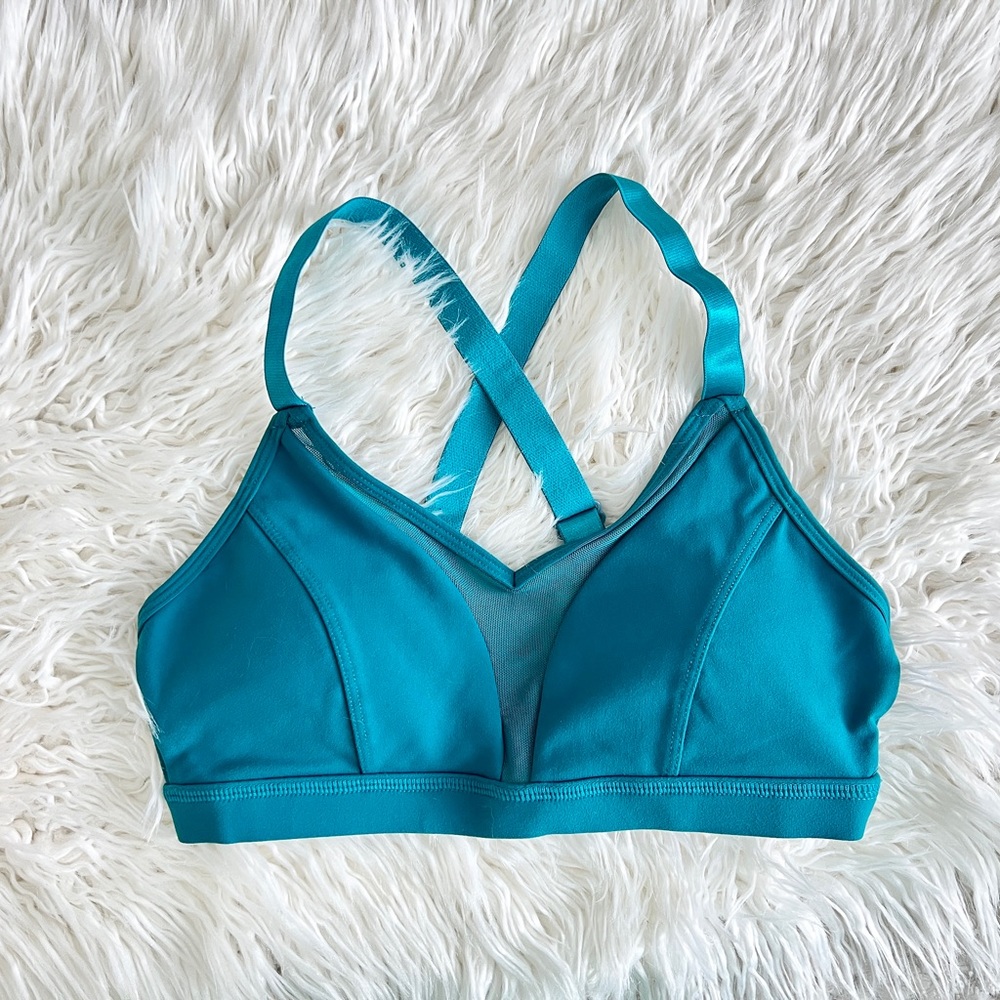 Born primitive teal sports bra